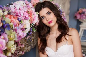 Bride leaning on her bridal bouquet