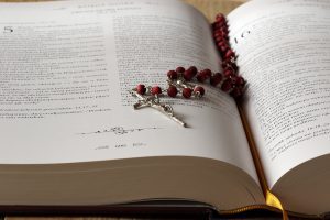 Rosary in open bible