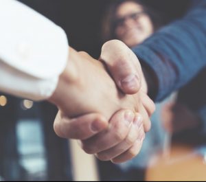 Businessman shaking businesswoman's hand