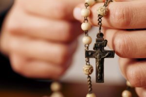 Woman holding Rosary